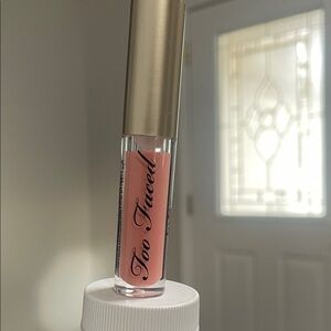 Too Faced Gloss with Gold Cap and Pink Hue